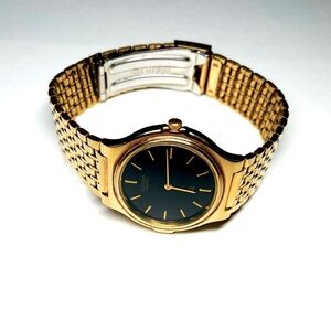 Citizen Watch, Men size 8 1/4 inches, Gold Plated, Black Dial, vintage